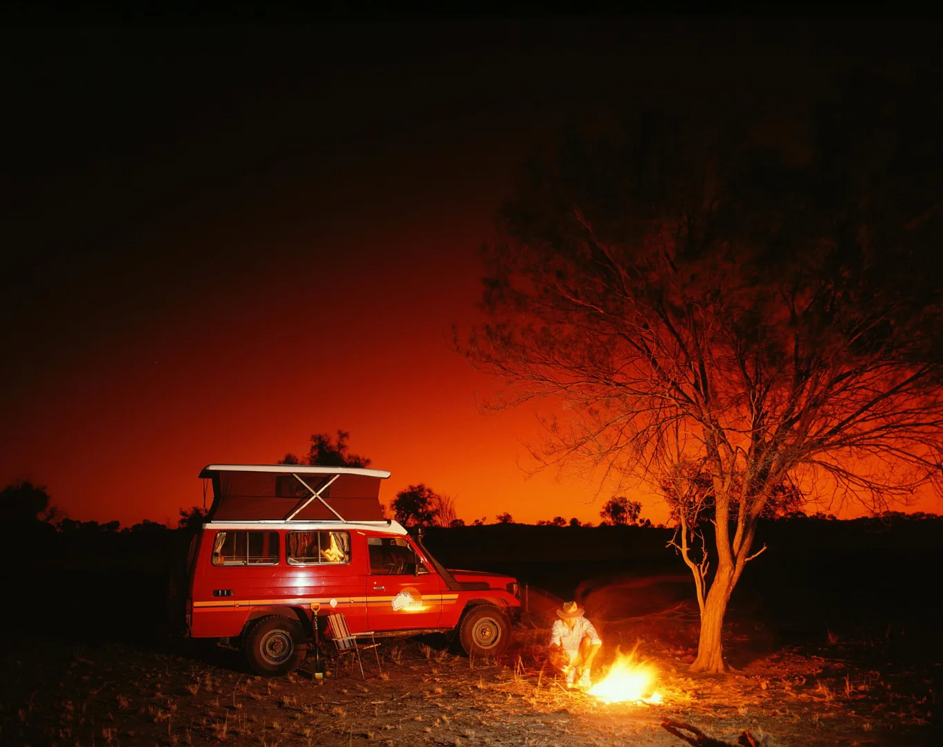 Car camping with a fireplace lit, cozy light. How to make car camping comfortable